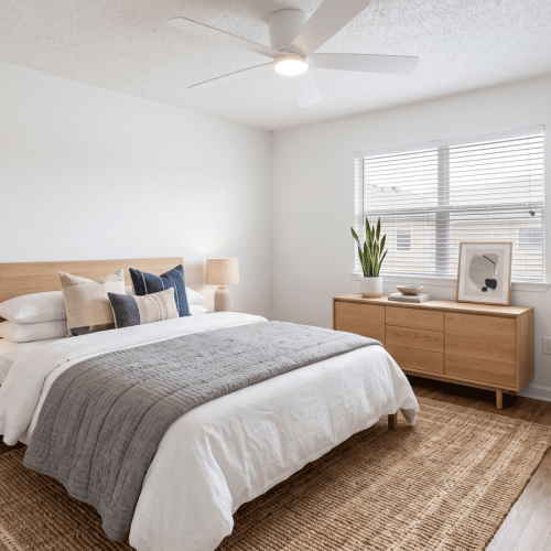 a room with bed and chair